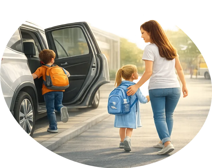 Mãe caminhando com os filhos até o carro na saída da escola